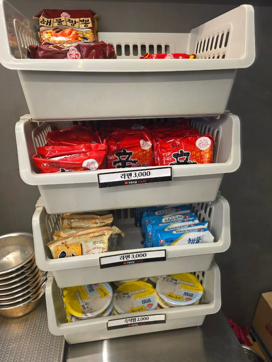 Side dish corner with chicken nuggets, sausages, and corn cheese
