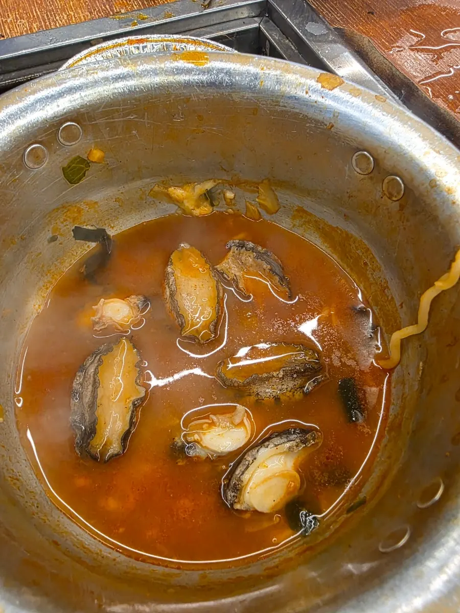 Spicy ramen broth with shellfish