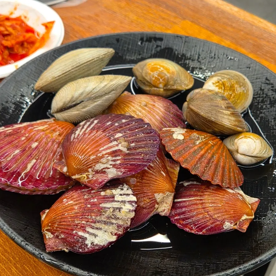 Second plate loaded only with scallops and abalone