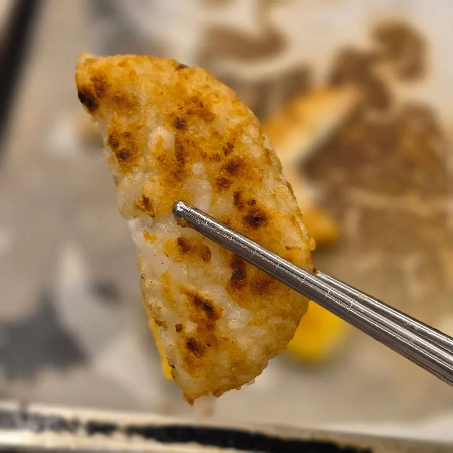 Hash browns and cheese sticks fried in butter