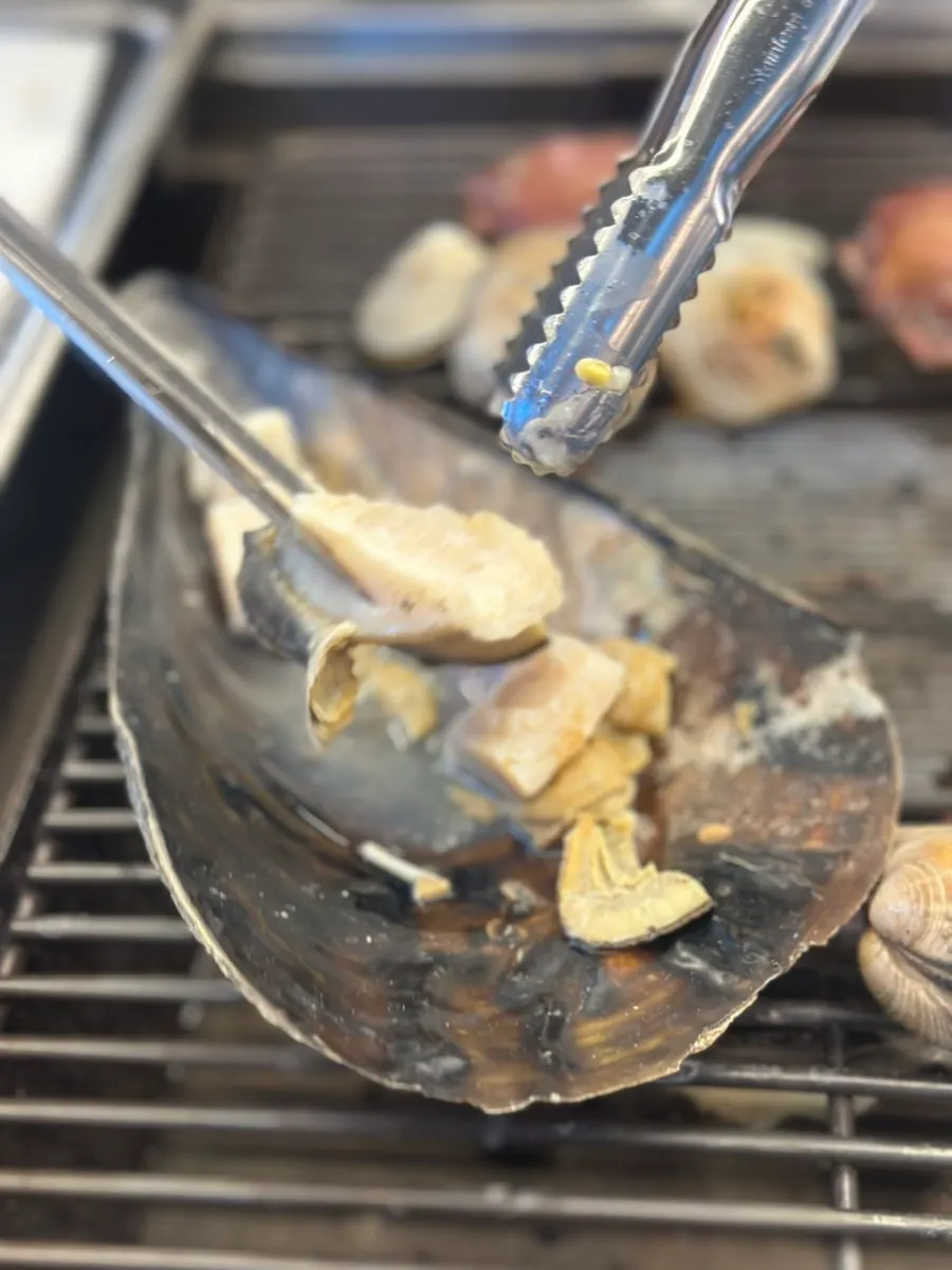 Giant clam grilled with cheese on top