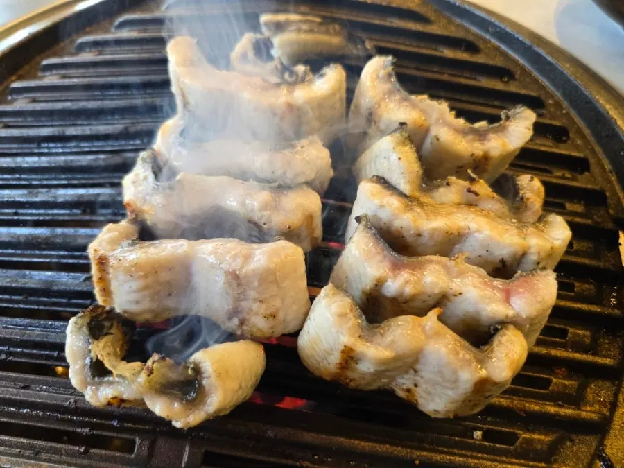 Pork belly and duck neck on the grill
