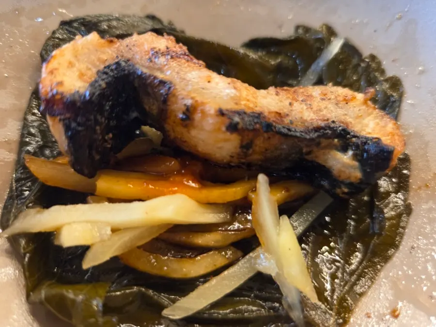 Duck neck cooking on the grill
