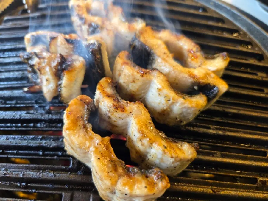 The grill piled high with eel