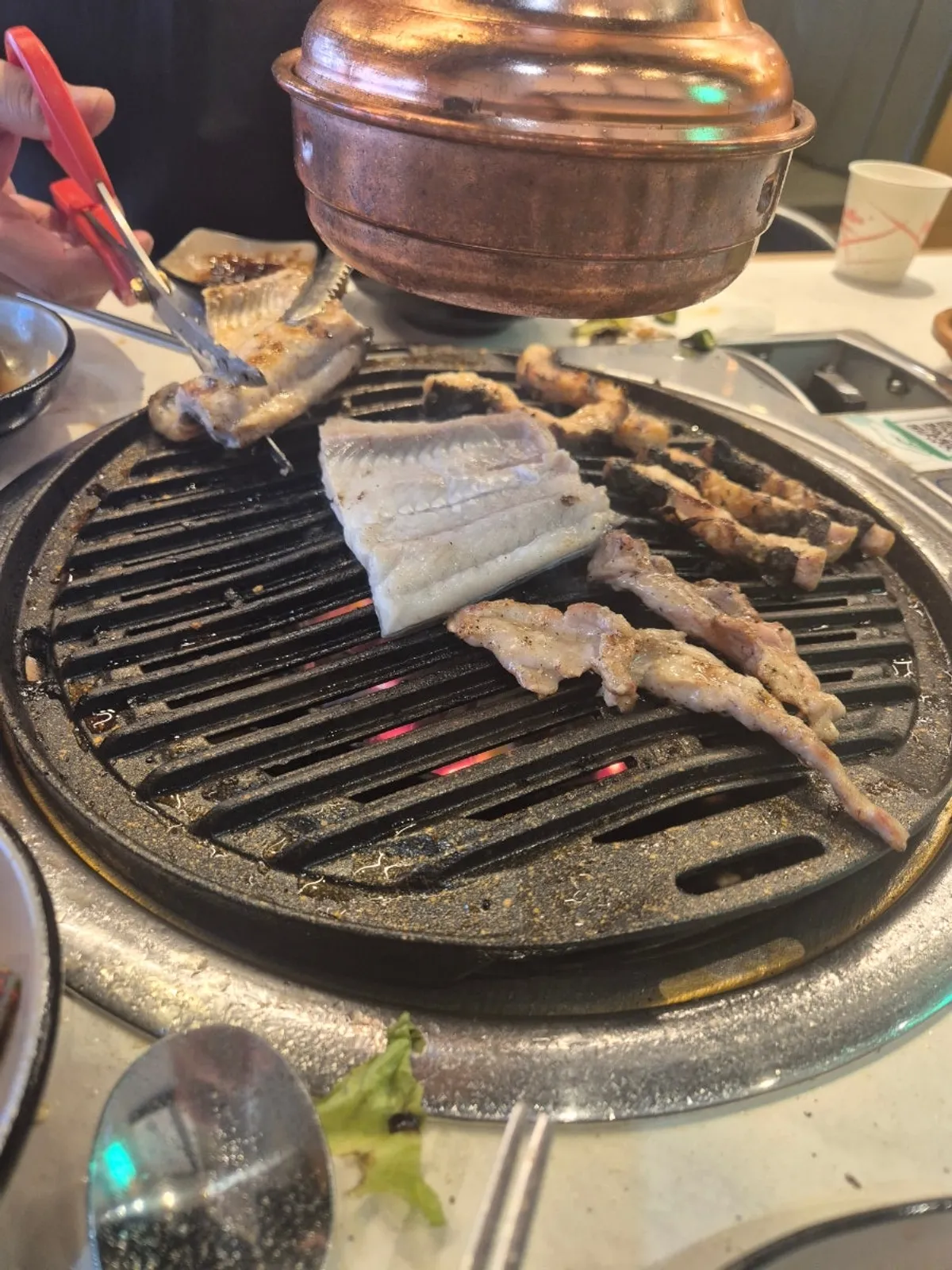 Eel grilling on the barbecue at Songnim Bok Jangeo's Baegot branch