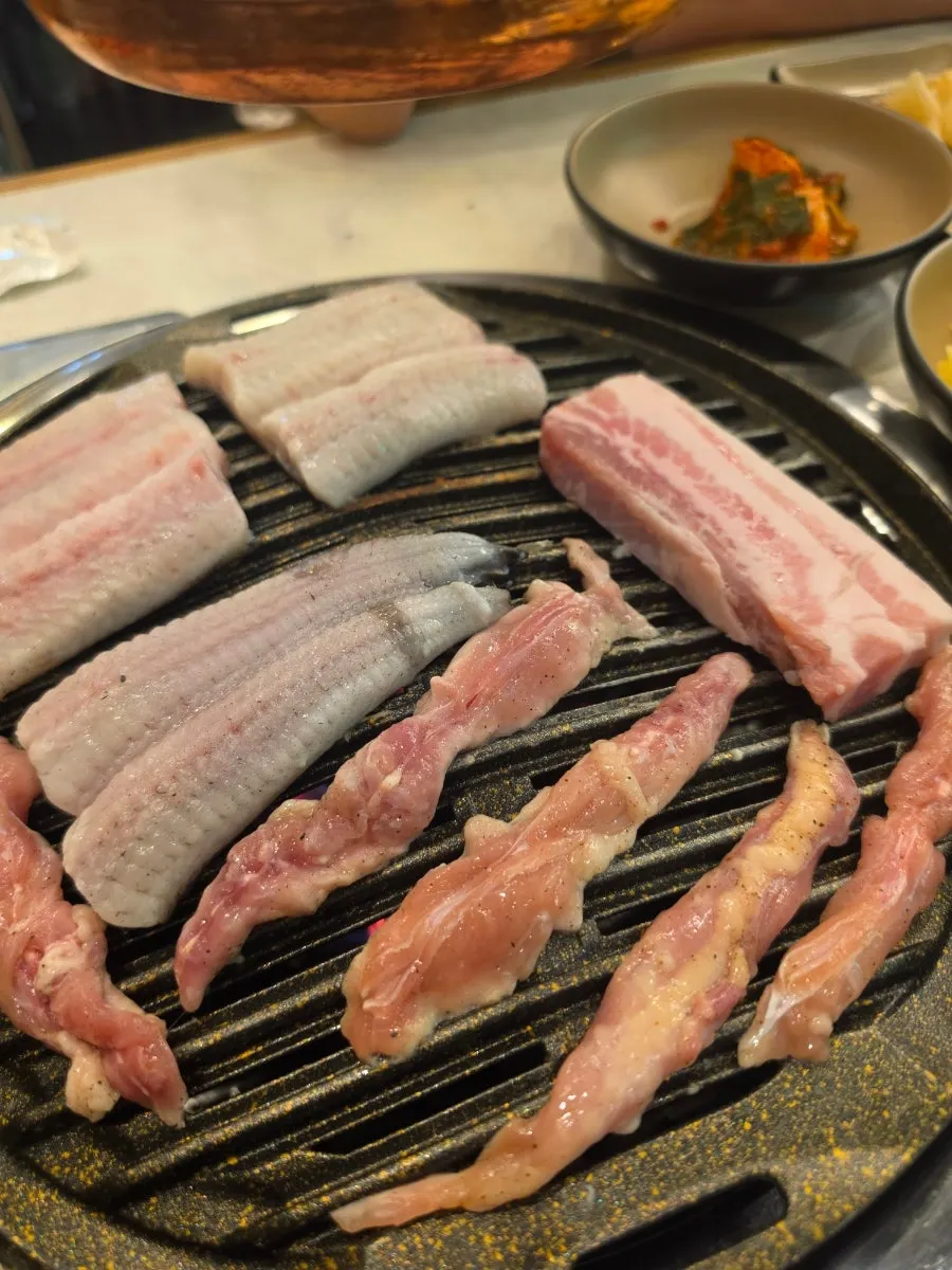 Eel grilling on a charcoal grill pan