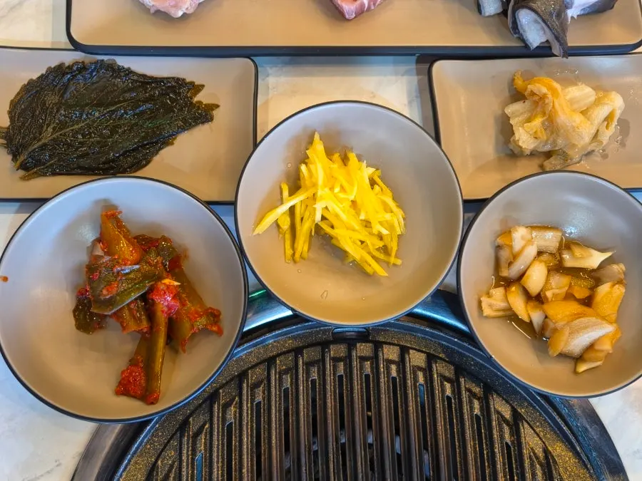 Basic table setting with chicken thigh, pork belly, and eel