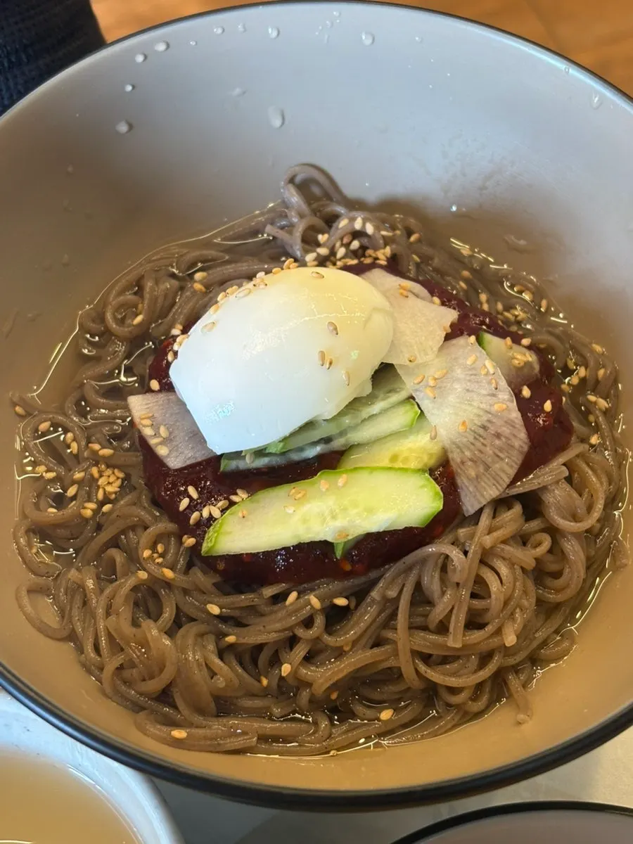 Bibim makguksu with ice-cold broth on the side