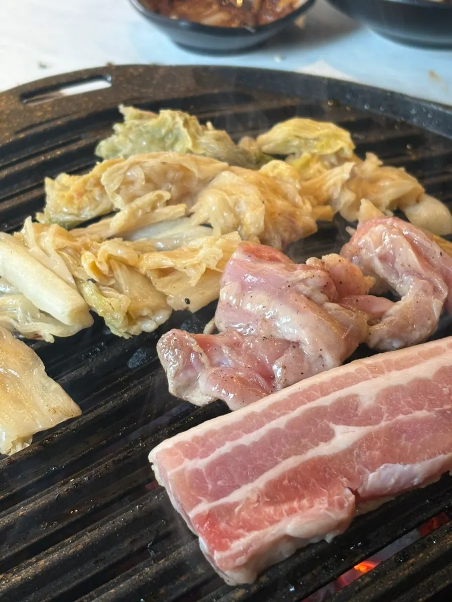 Grilled meat eaten alongside the noodles