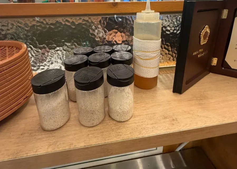 Whole pork belly and duck neck displayed at the self-serve bar