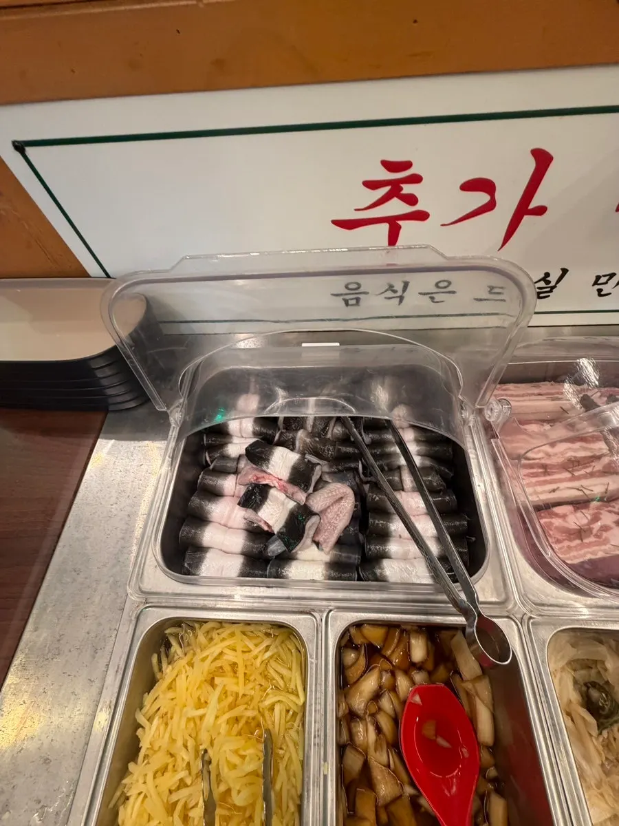 Ginger, pickled onion, and other condiments at the self-serve bar