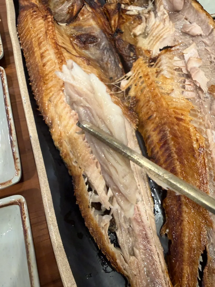 Flaked apart grilled rock bream
