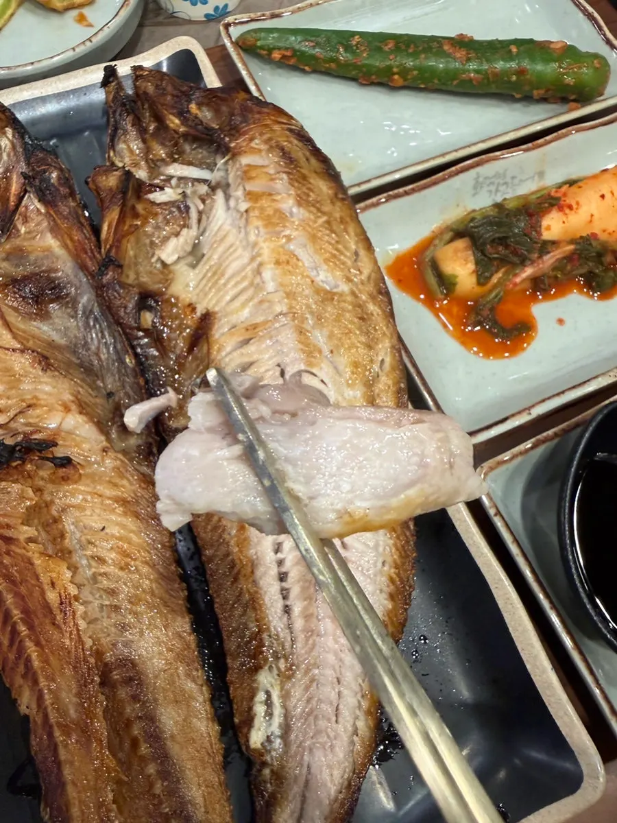 A piece of rock bream placed on hot pot rice