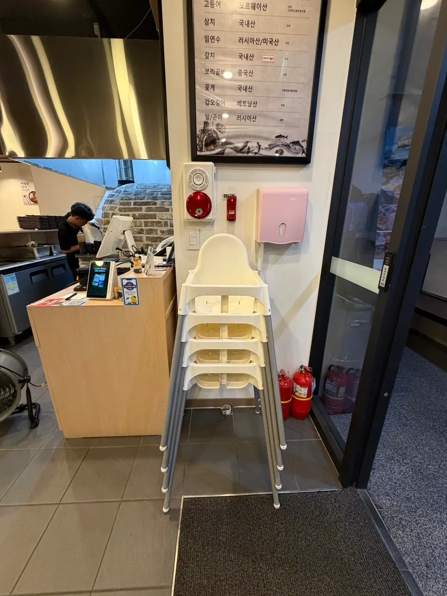 Plates and bibimbap bowls below the self-serve bar