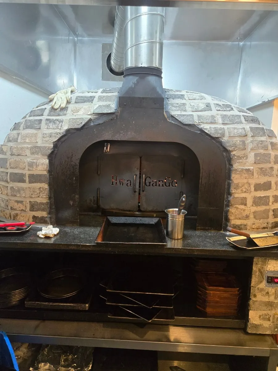 The fish-grilling oven on one side of the restaurant