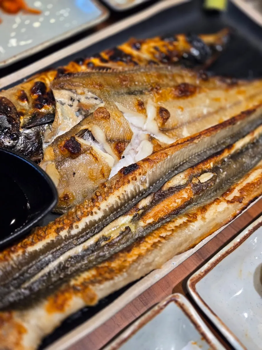 Close-up of three kinds of oven-grilled fish