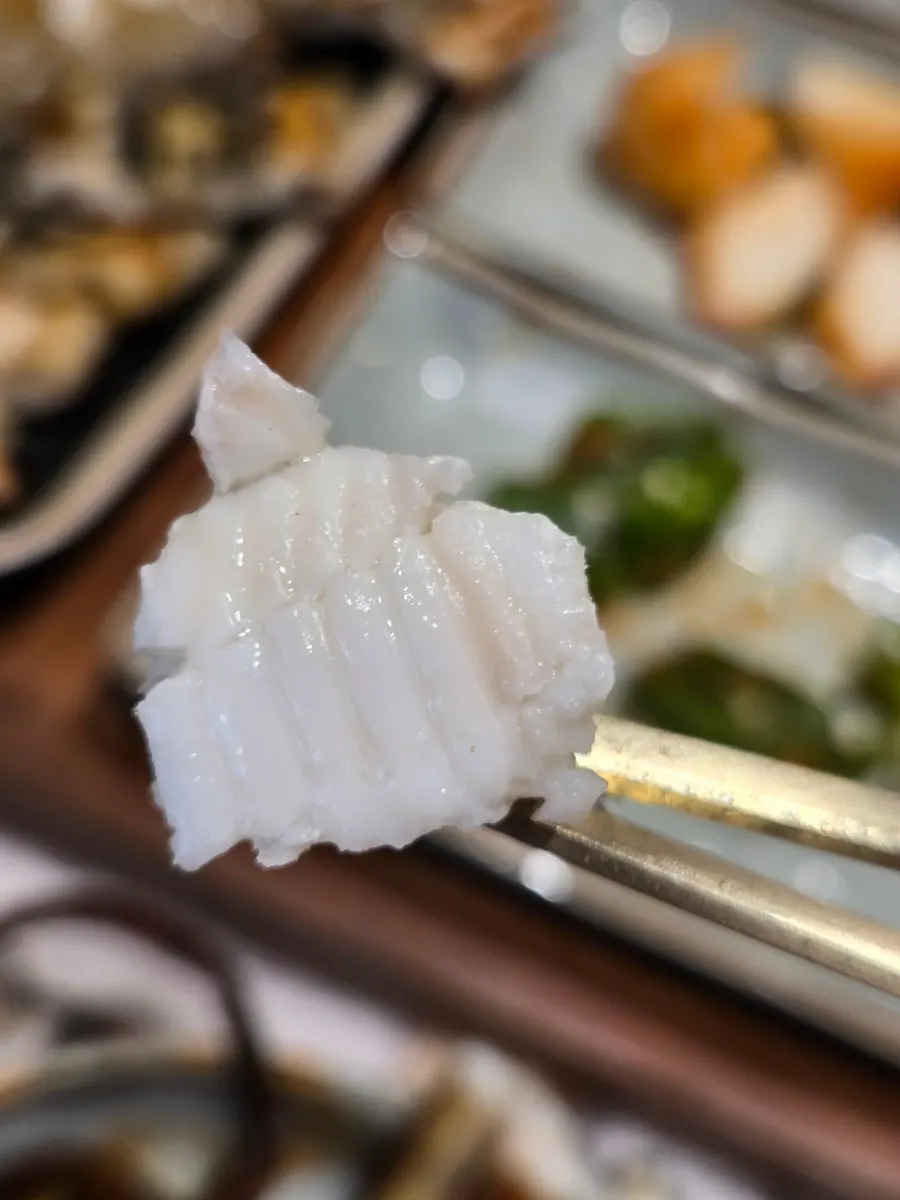 Grilled flounder with white flesh showing