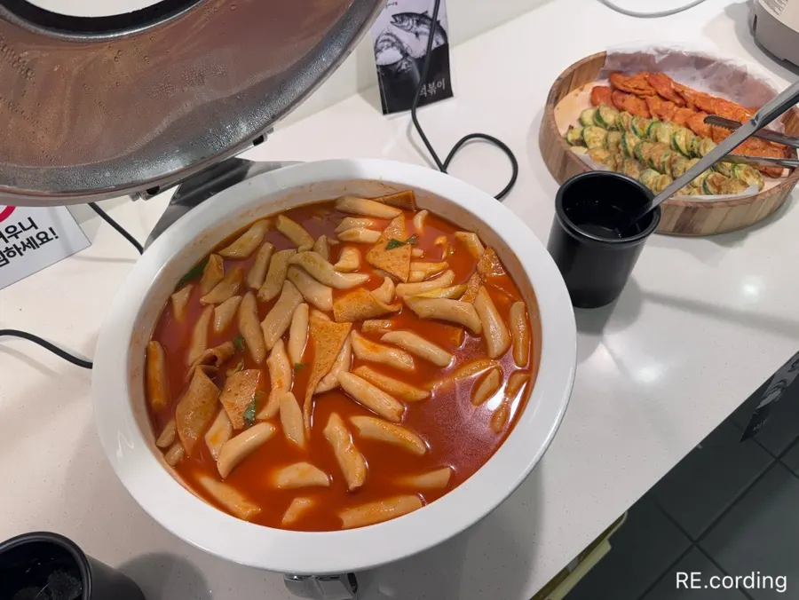 Japchae and tteokbokki at the self-serve bar