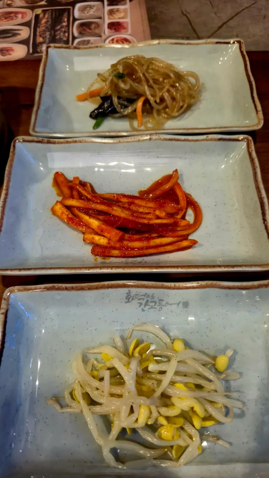 Diced radish kimchi and vegetable side dishes served as basics