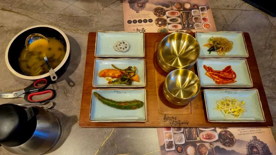 Wide photo of the table set with side dishes