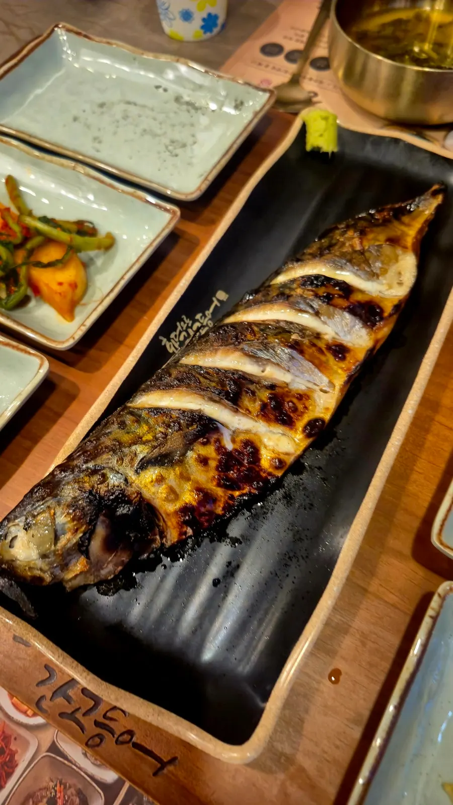 Mackerel flesh picked off and piled onto rice