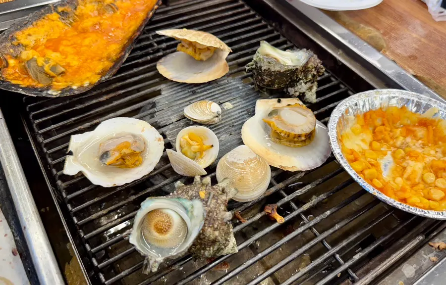 Grilled scallops and seasonal horned turban shells