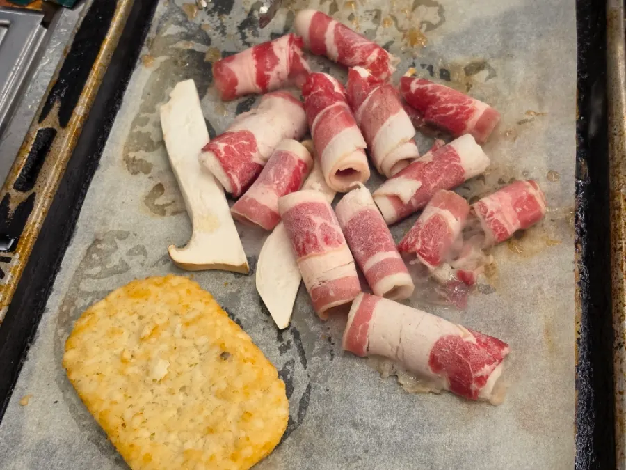 Scallops topped with cheese and corn