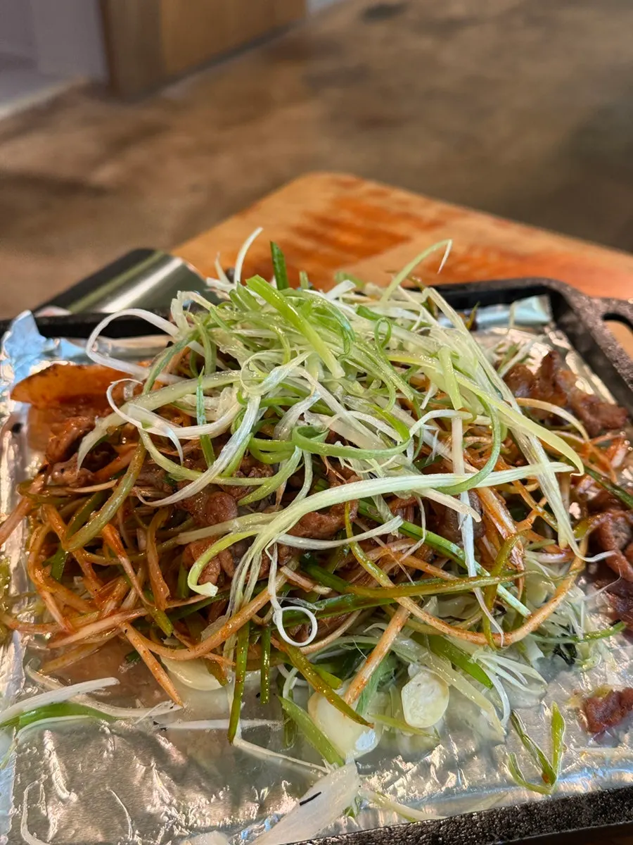 Bibim guksu served alongside a meat meal