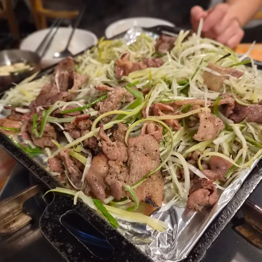 Scallion bulgogi browning on the grill