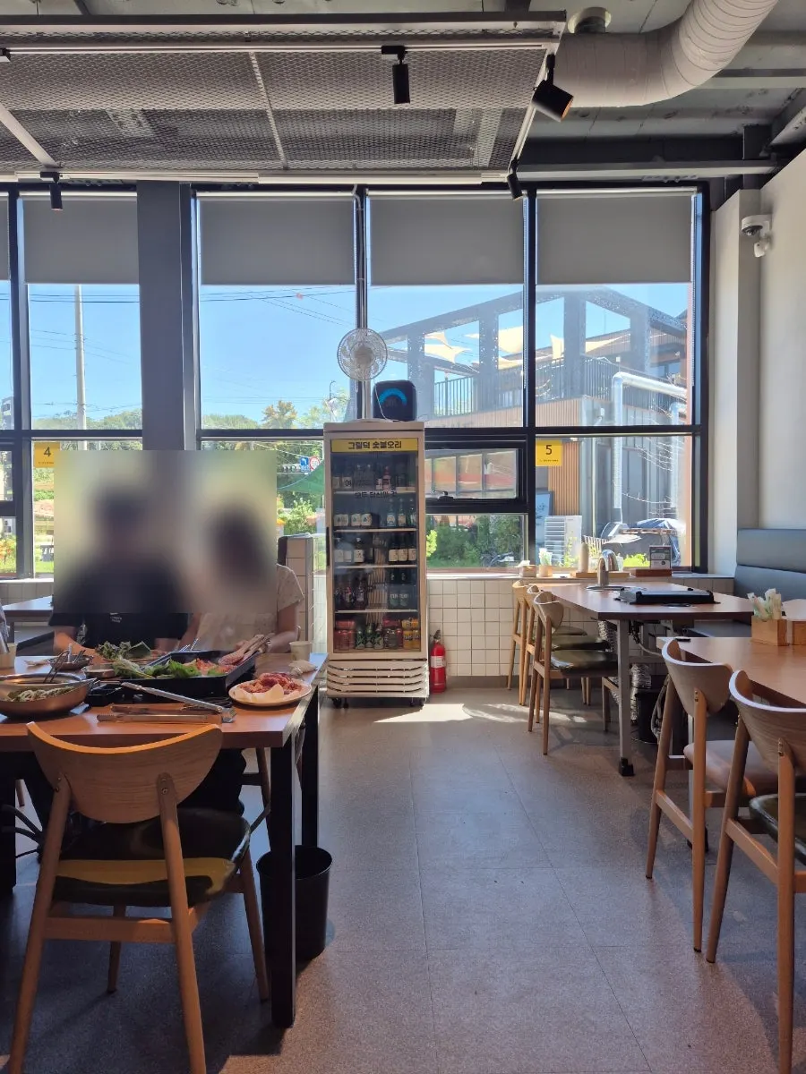 Bright restaurant with floor-to-ceiling windows