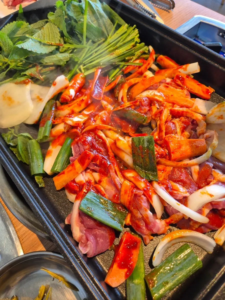 Fresh duck jumulleok topped with sauce