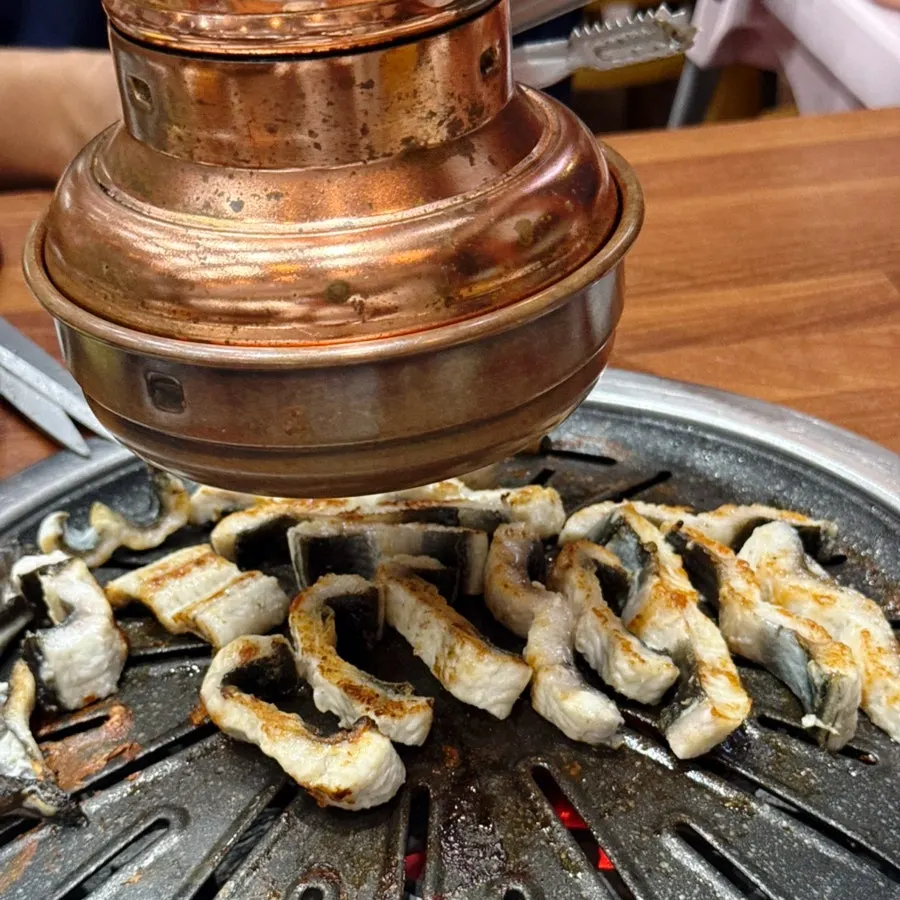 Self-service bar stocked with eel and side dishes
