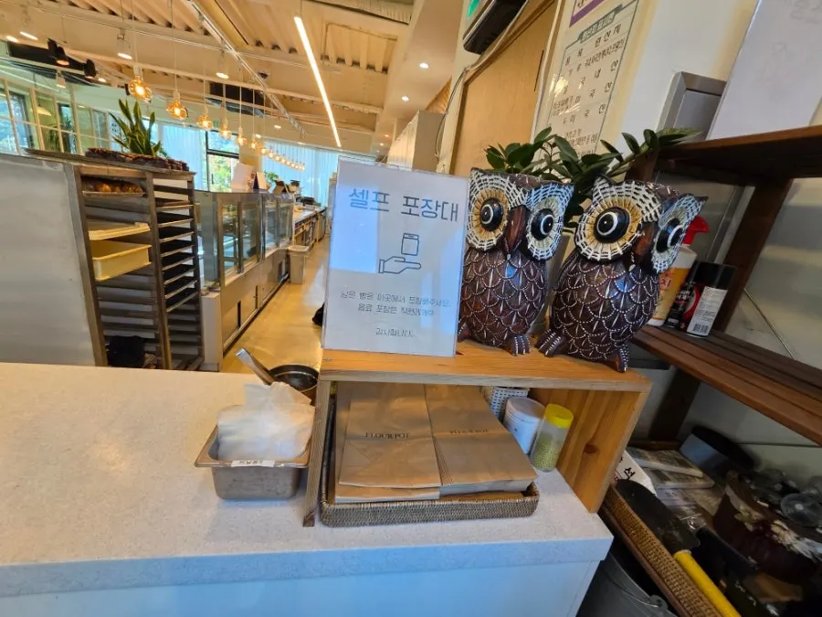 Knives and forks set out at the end of the display case
