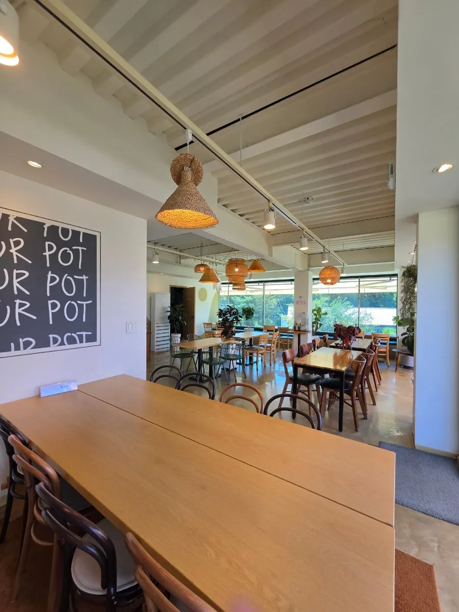 Third-floor outdoor terrace of Flowerpot Cafe with artificial grass
