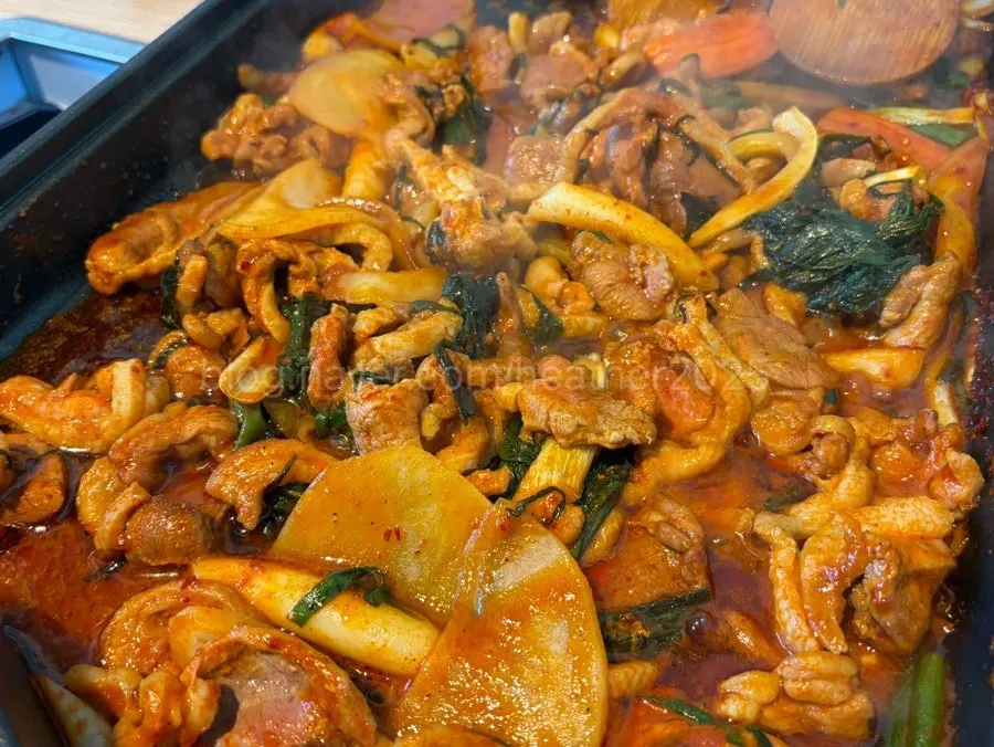 Whole marinated duck loaded with vegetables