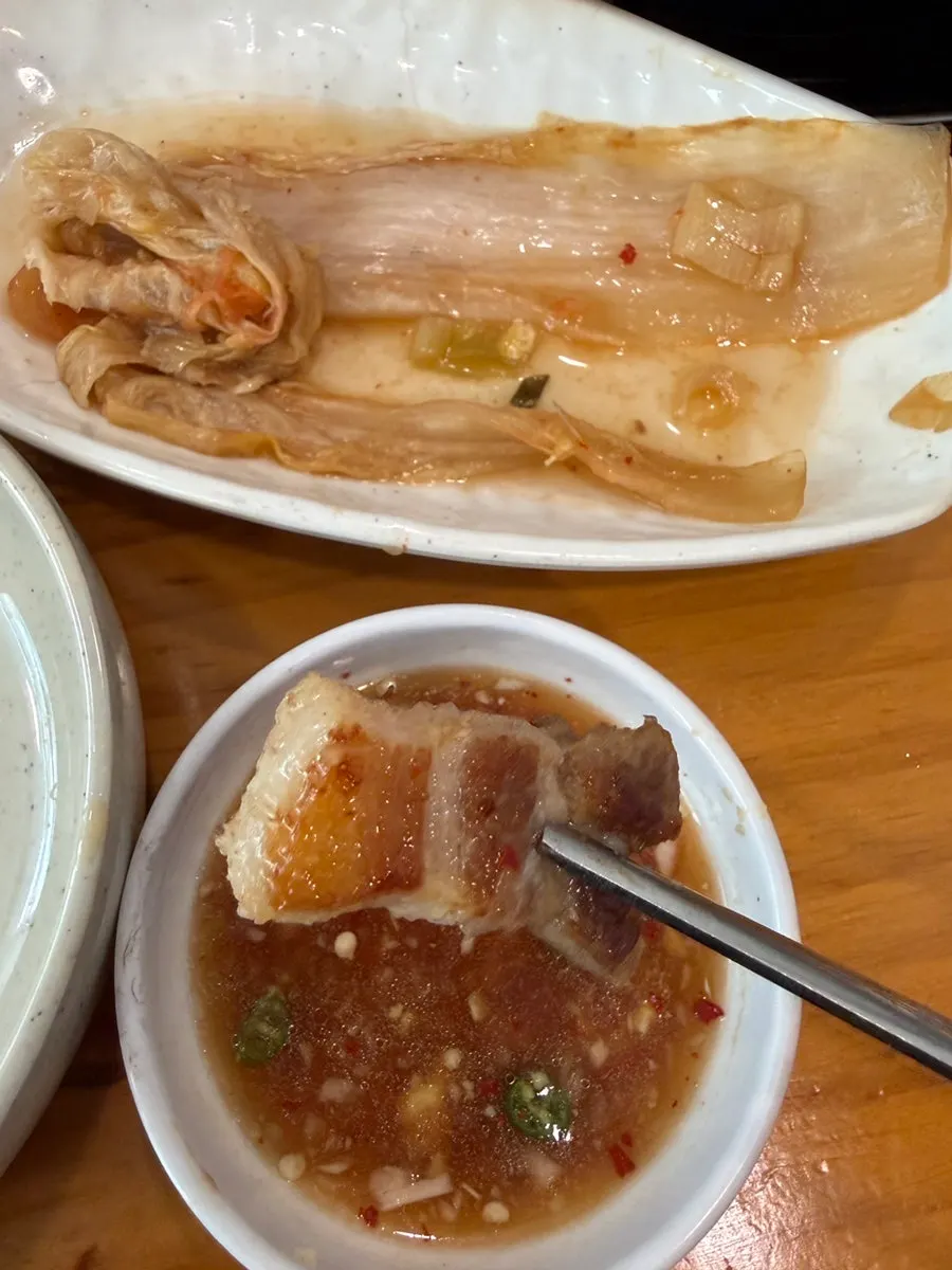 Aged kimchi grilling in pork fat