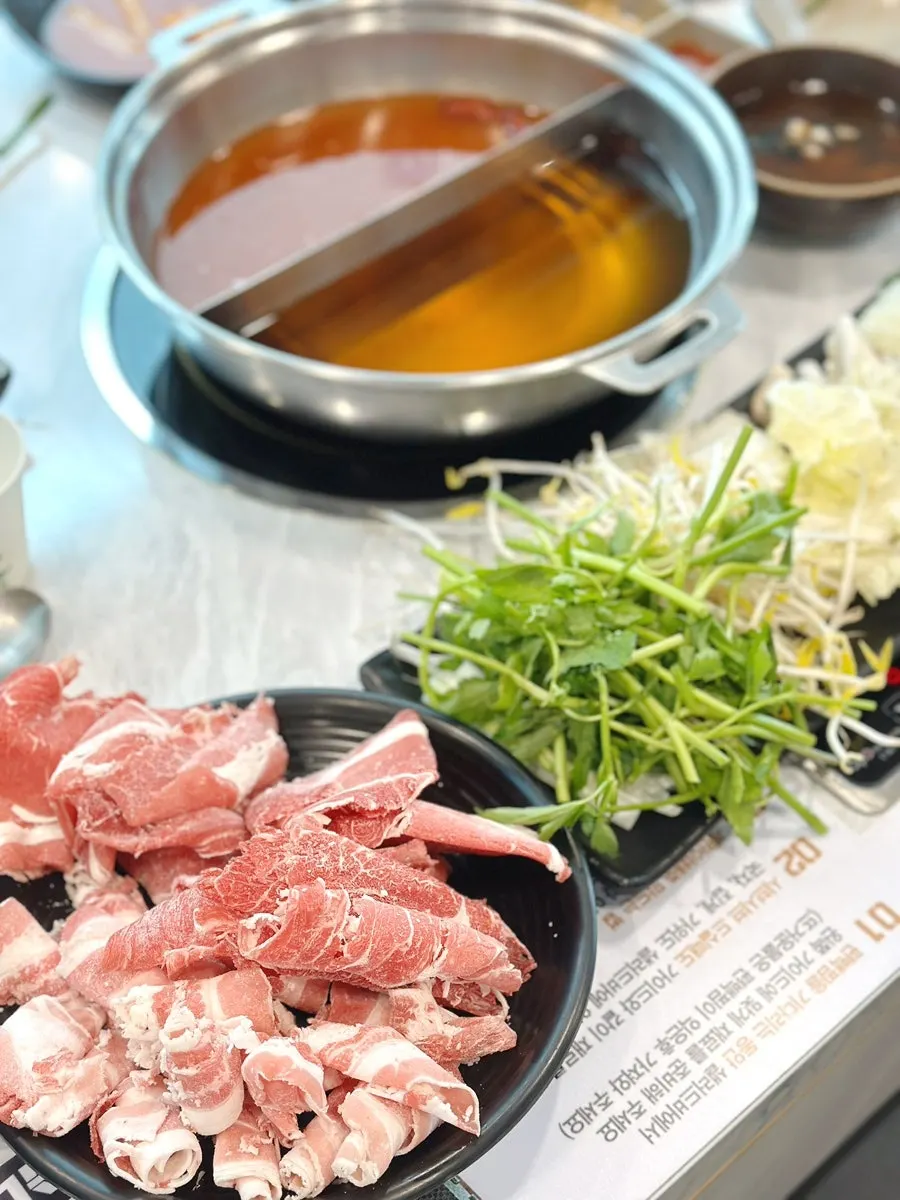 Half mild and half spicy shabu-shabu broth