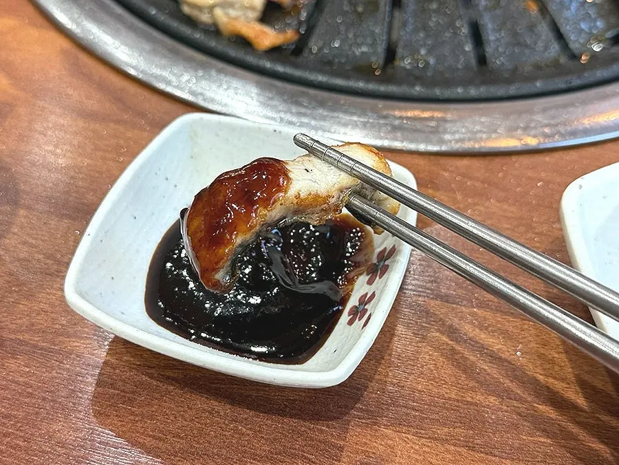 Grill piled high with meat and eel