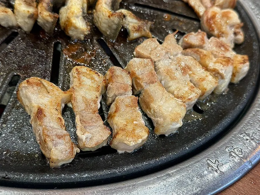 Table spread enjoying eel and meat together