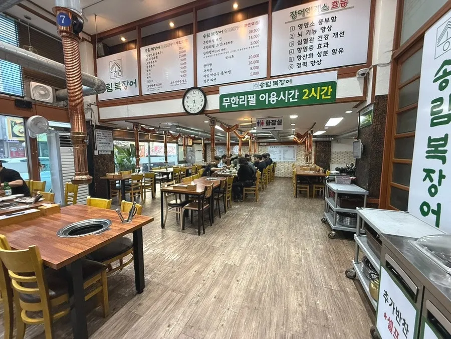 Spacious restaurant floor comfortably seating a large group