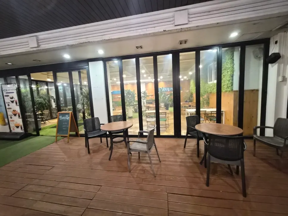 Café exterior with evening lights on
