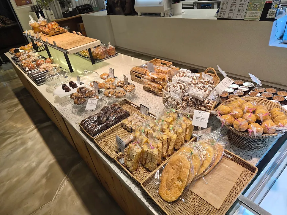 Strawberry croissants topped with cream and strawberries on display