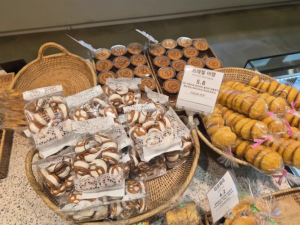 Bakery display with white bread and tarts