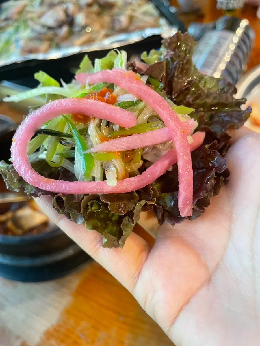 A piece of charcoal pre-grilled pork belly with the fat rendered off