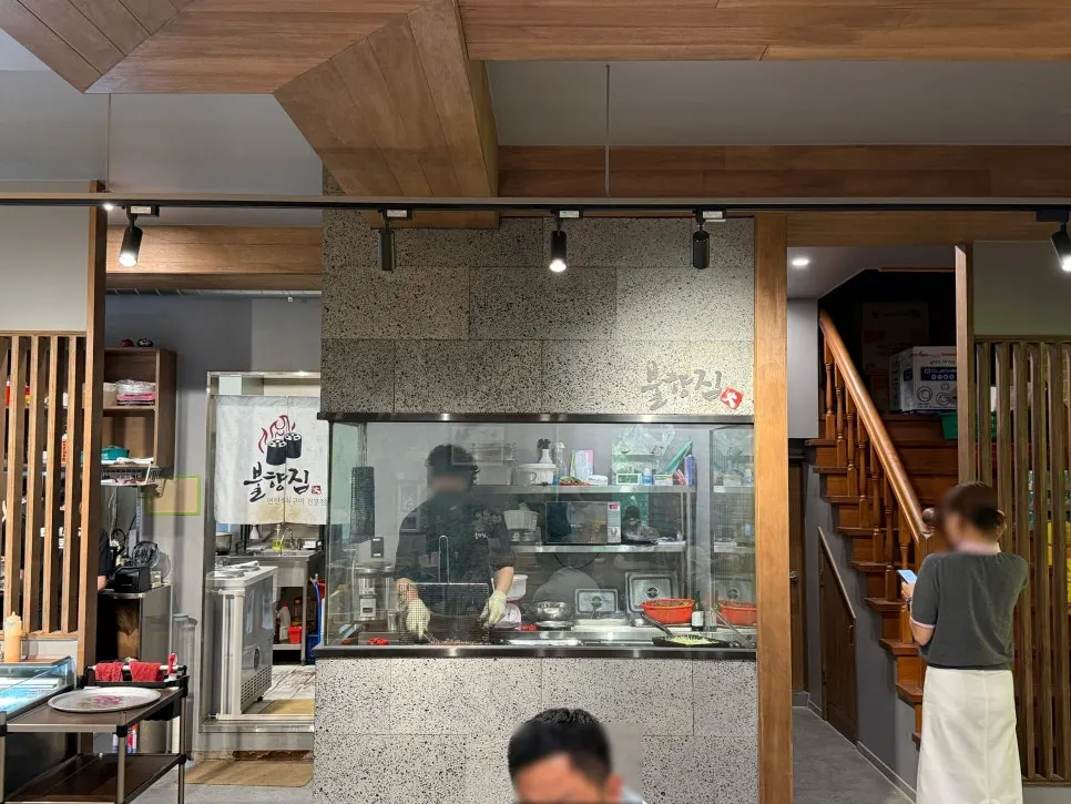 A dining table at Bulhyangjip with a green view through the window