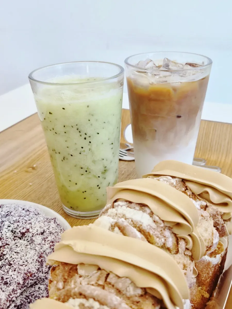 Blueberry cream cheese bread, mocha cream bread, latte, and kiwi juice