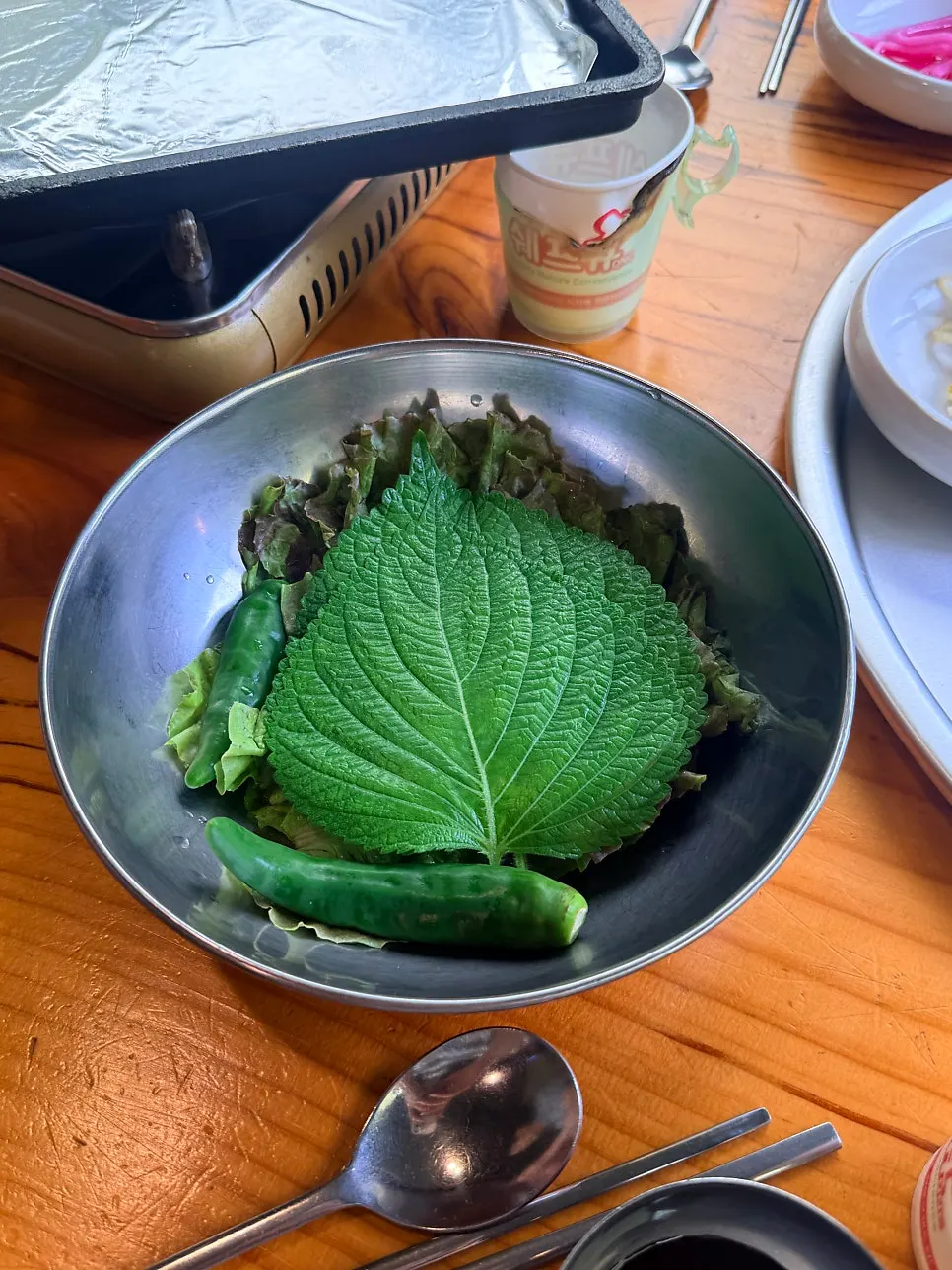 Plate of various ssam vegetables gathered from the self-serve bar