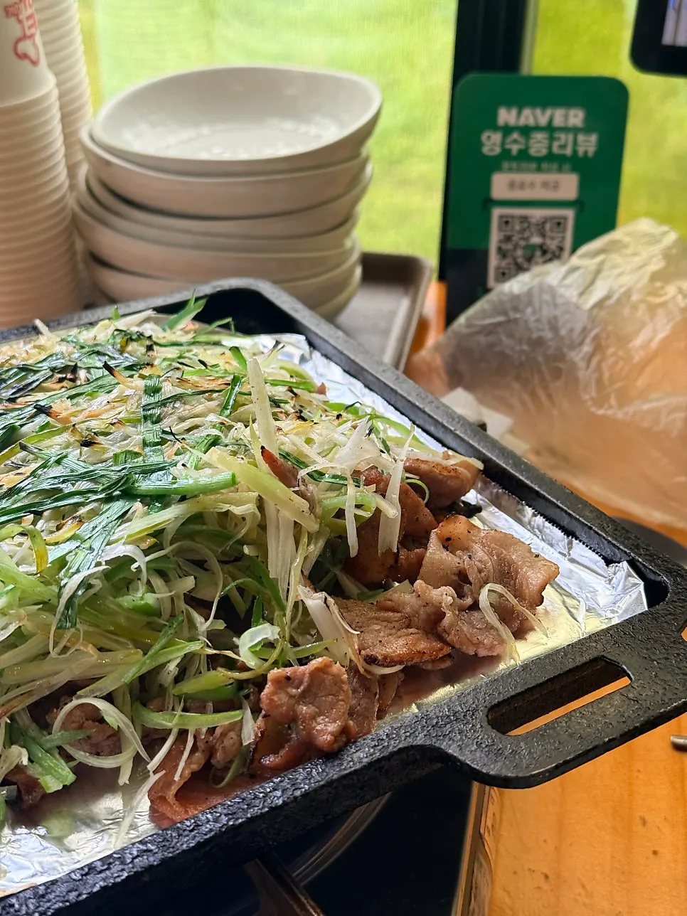 Charcoal scallion bulgogi piled high with grilled scallions