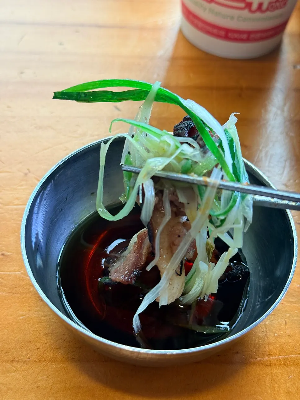 Bulgogi and scallions dipped in the special sauce