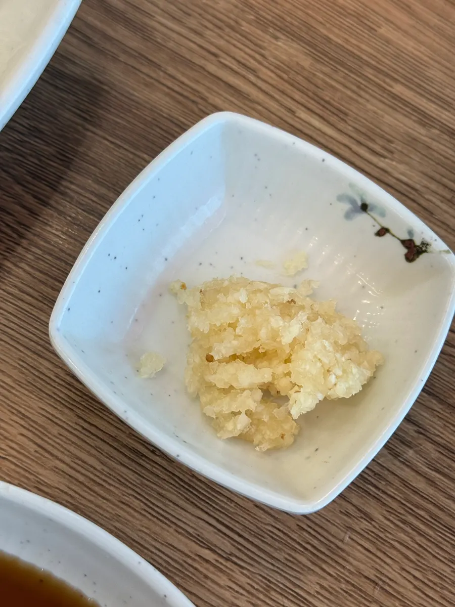 Water for the hot-pot rice set alongside the basic side dishes